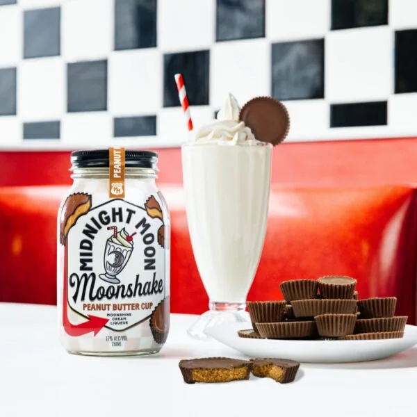 Boozy Moonshine Cream Peanut Butter Cup Milkshake in a Diner