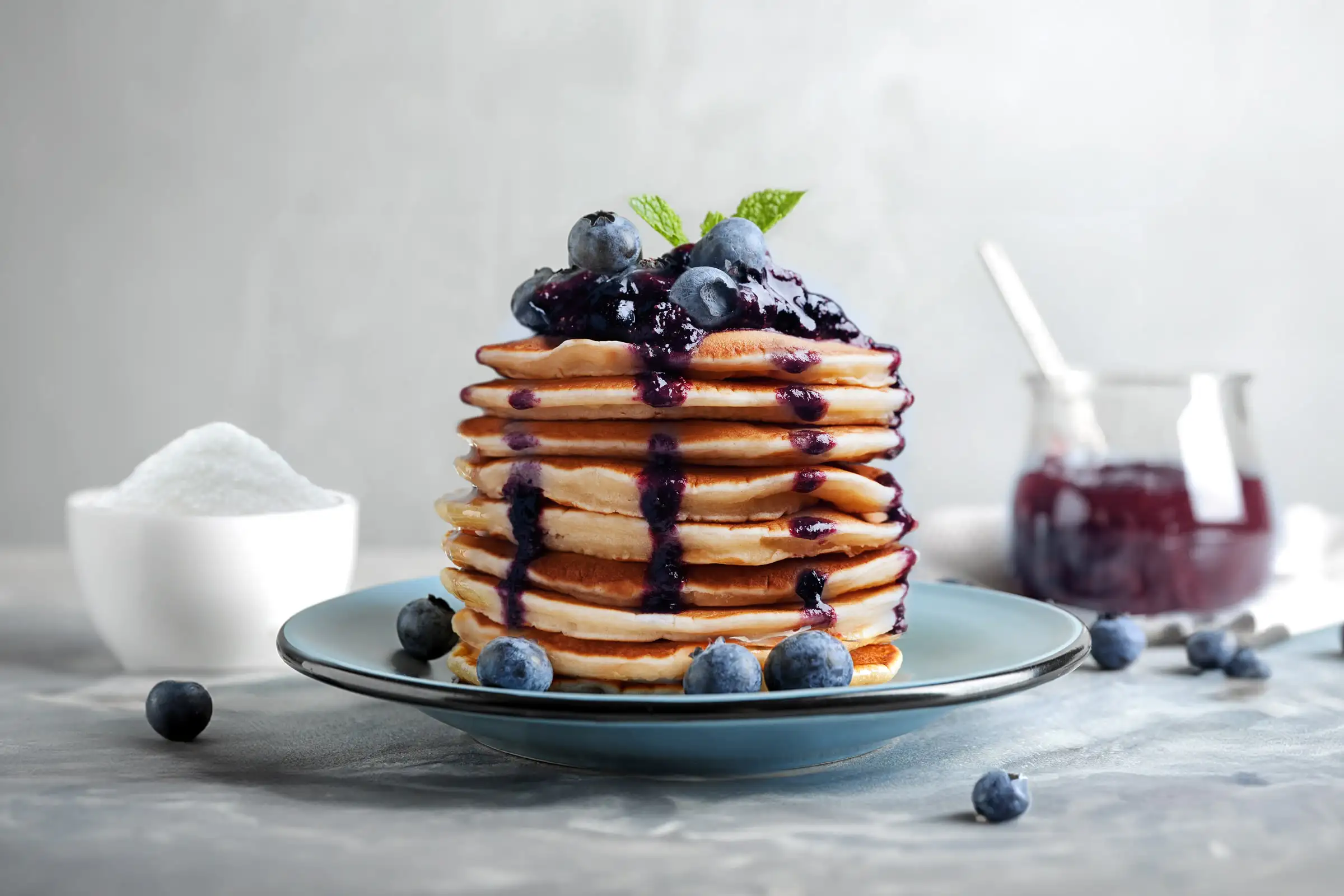 Stack of pancakes with blueberry moonshine compote