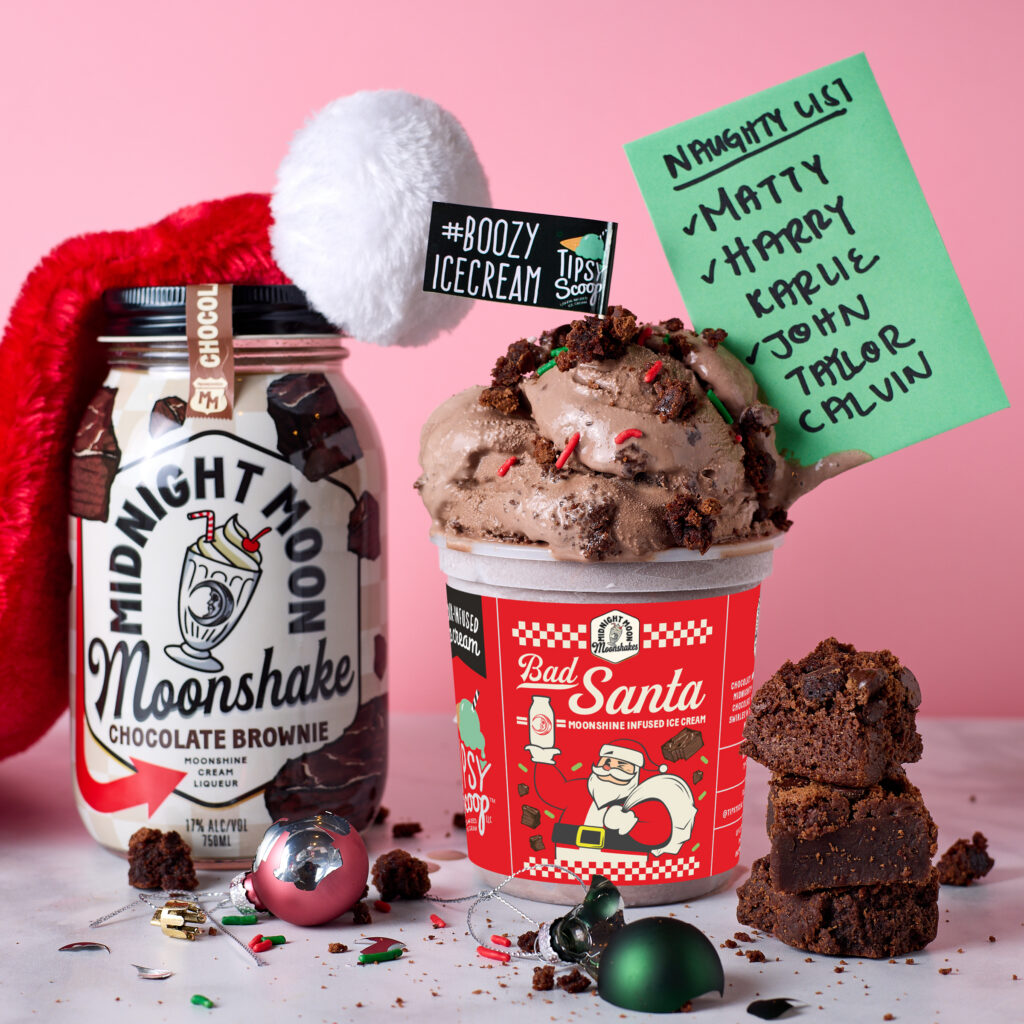 Midnight Moon Chocolate Brownie moonshine next to Tipsy Scoop Bad Santa ice cream with a Santa hat and ornaments.